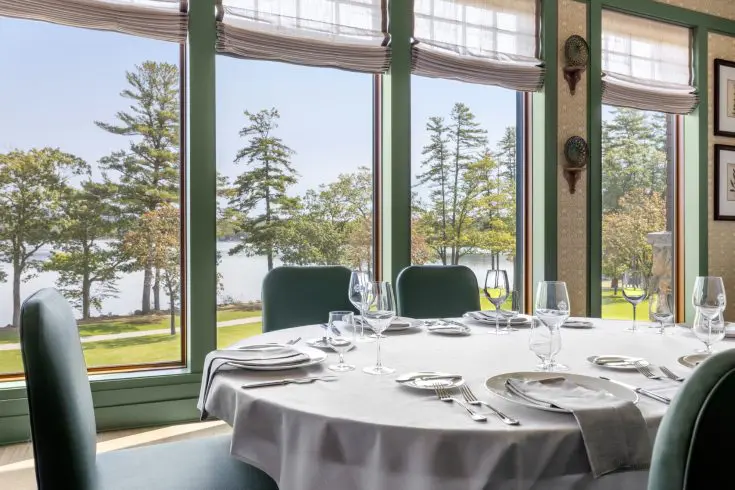 Round dining table with panoramic lake views