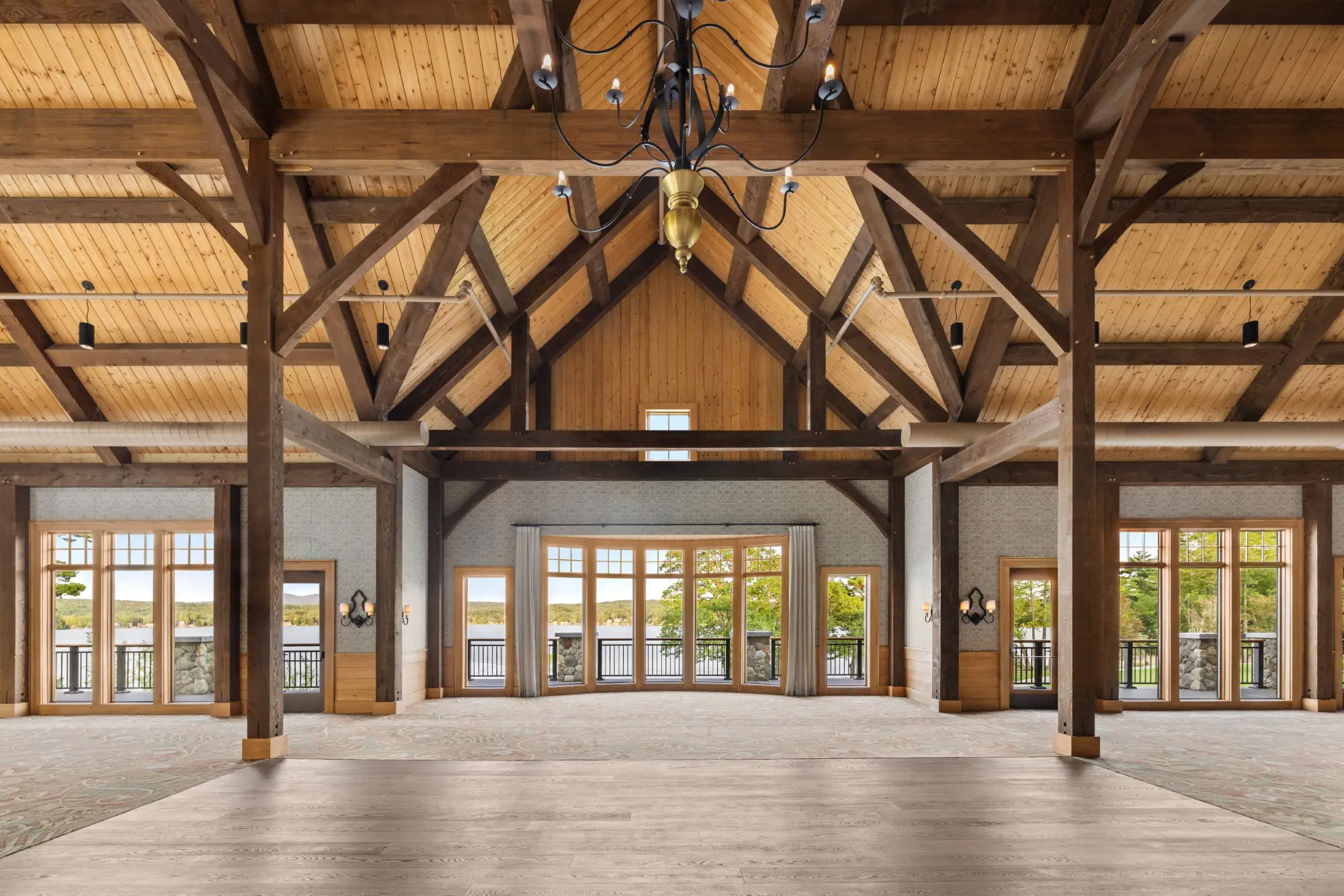 Ballroom with vaulted ceiling and wood beams