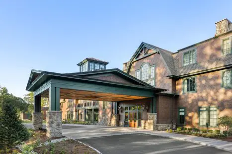 Hotel entrance with covered portico and stone pillars