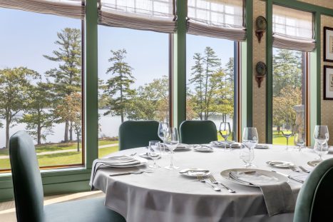 Round dining table with panoramic lake views